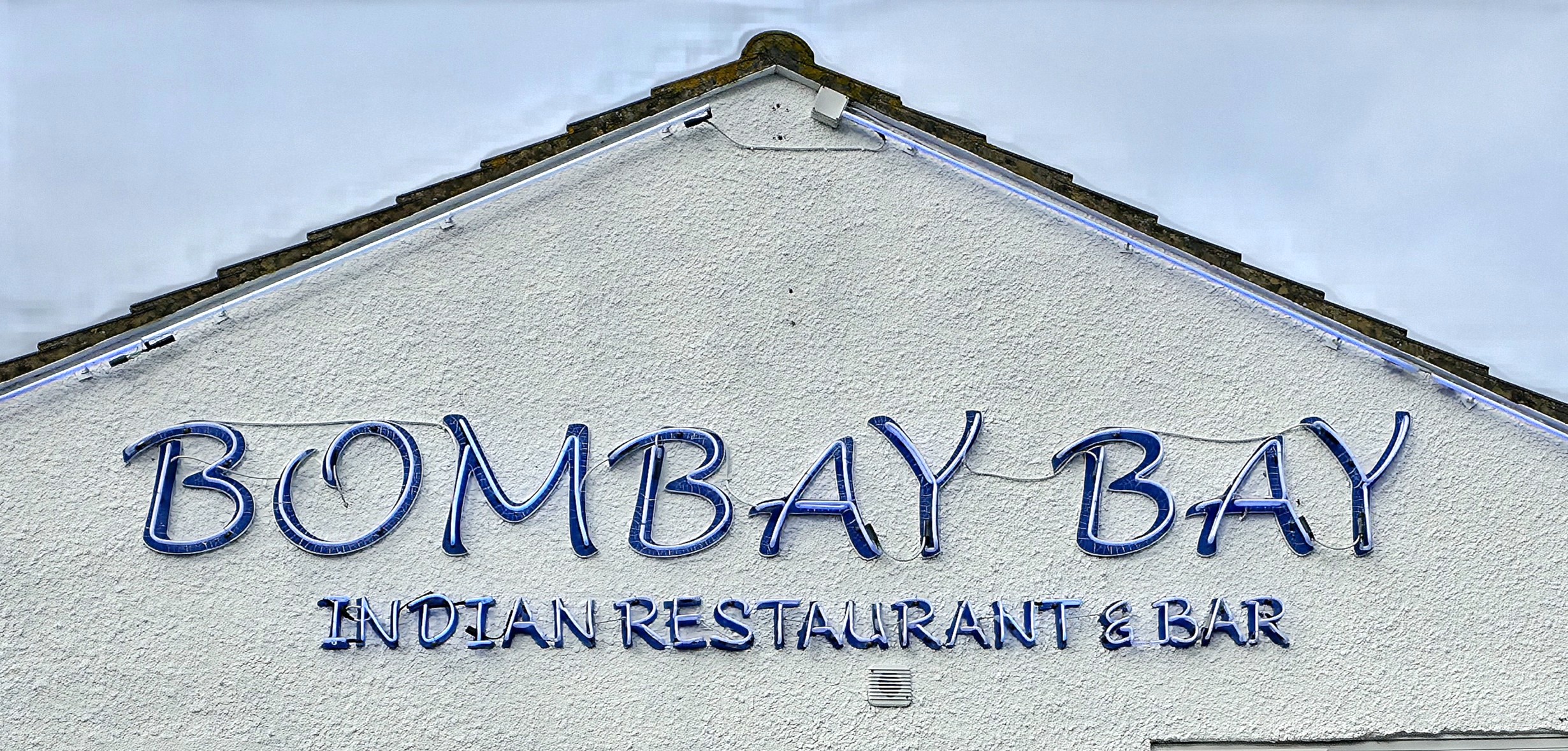 Bombay Bay, Southsea, Hampshire, United Kingdom, Indian Cuisine wall sign advertisement.