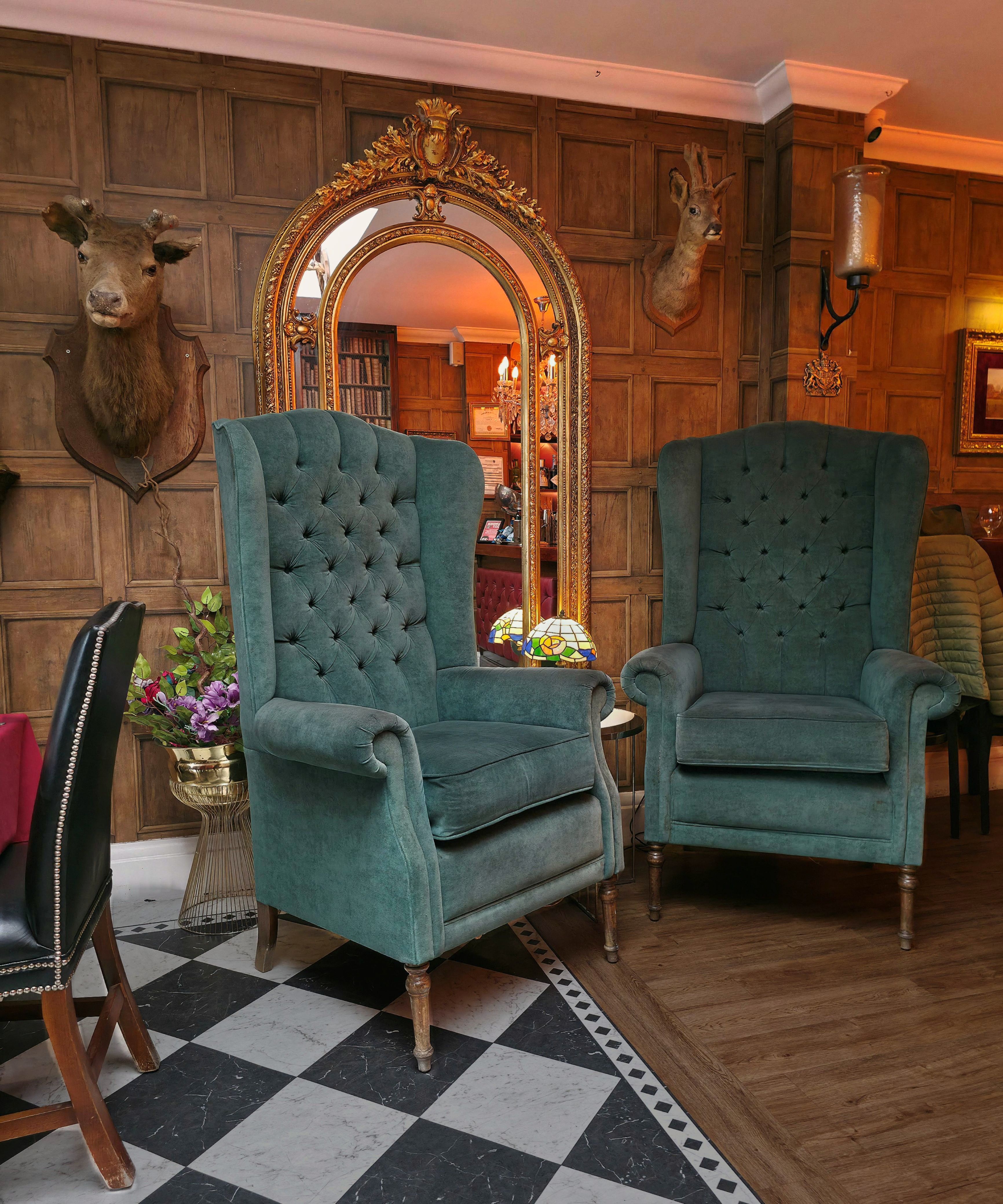 A photo taken of the sea blue, green chairs inside Chambers, Southsea in November 2025, by Baldi, A.K.A Amonn AL-Mahrouq