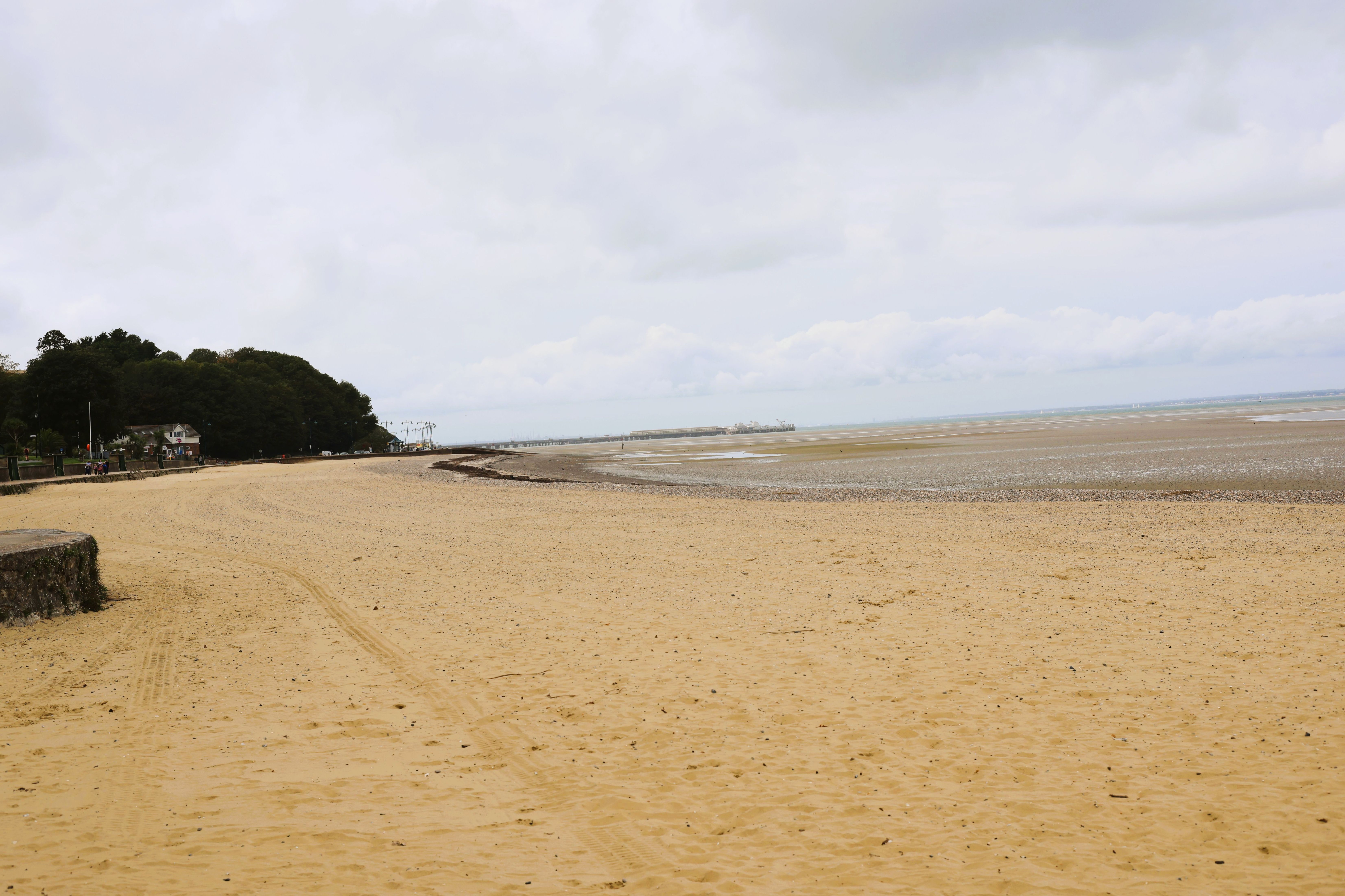 A crystal clear empty beach with wide sand running out to open water, creating space for my mind to wander and create. Photo taken on the Isle of Wight in September 2026 by Baldi, A.K.A. Amonn AL-Mahrouq.