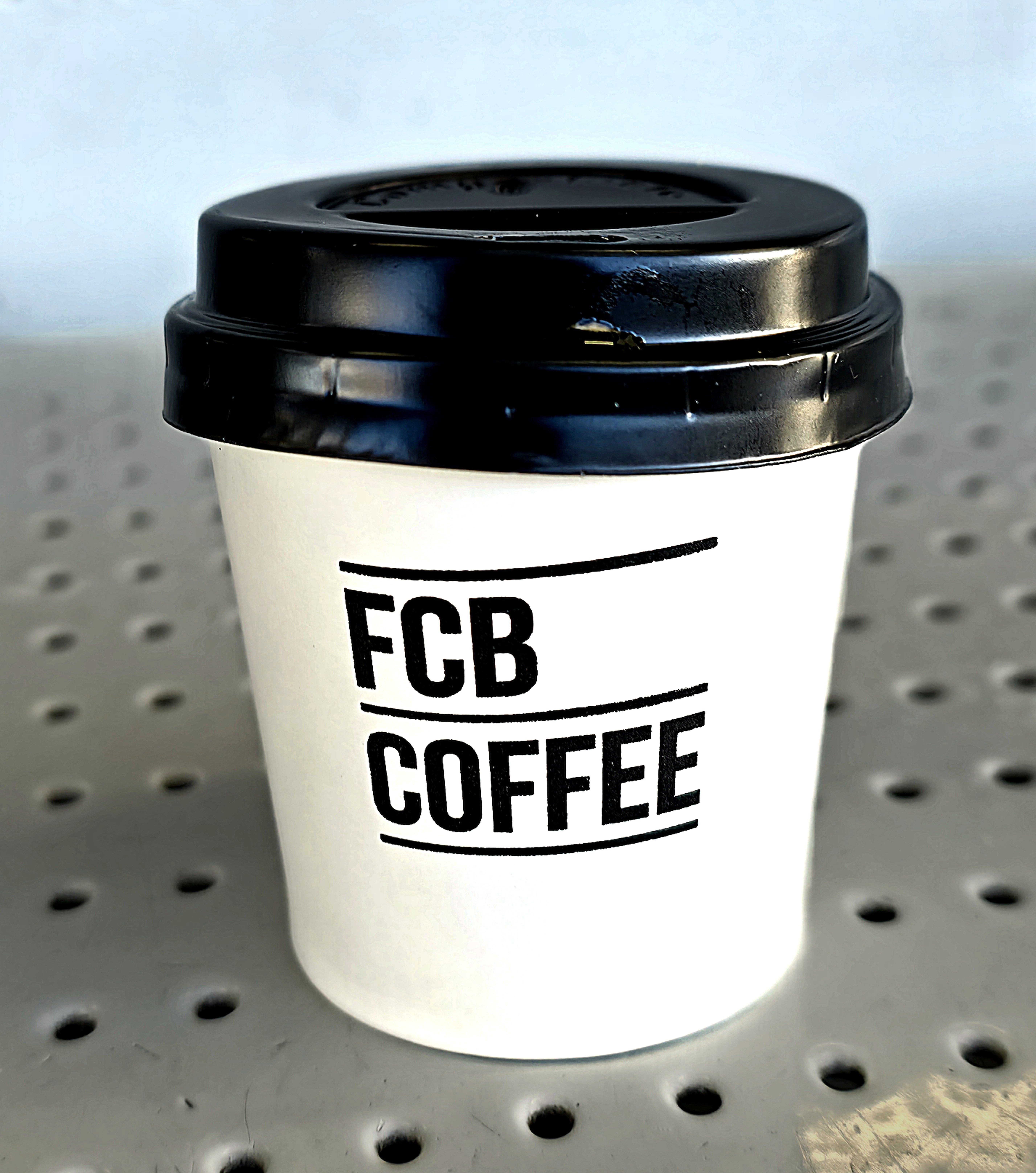 Photo of FCB Coffee Logo on a Coffee Cup. Photo taken in September 2026 by Baldi, A.K.A Amonn AL-Mahrouq