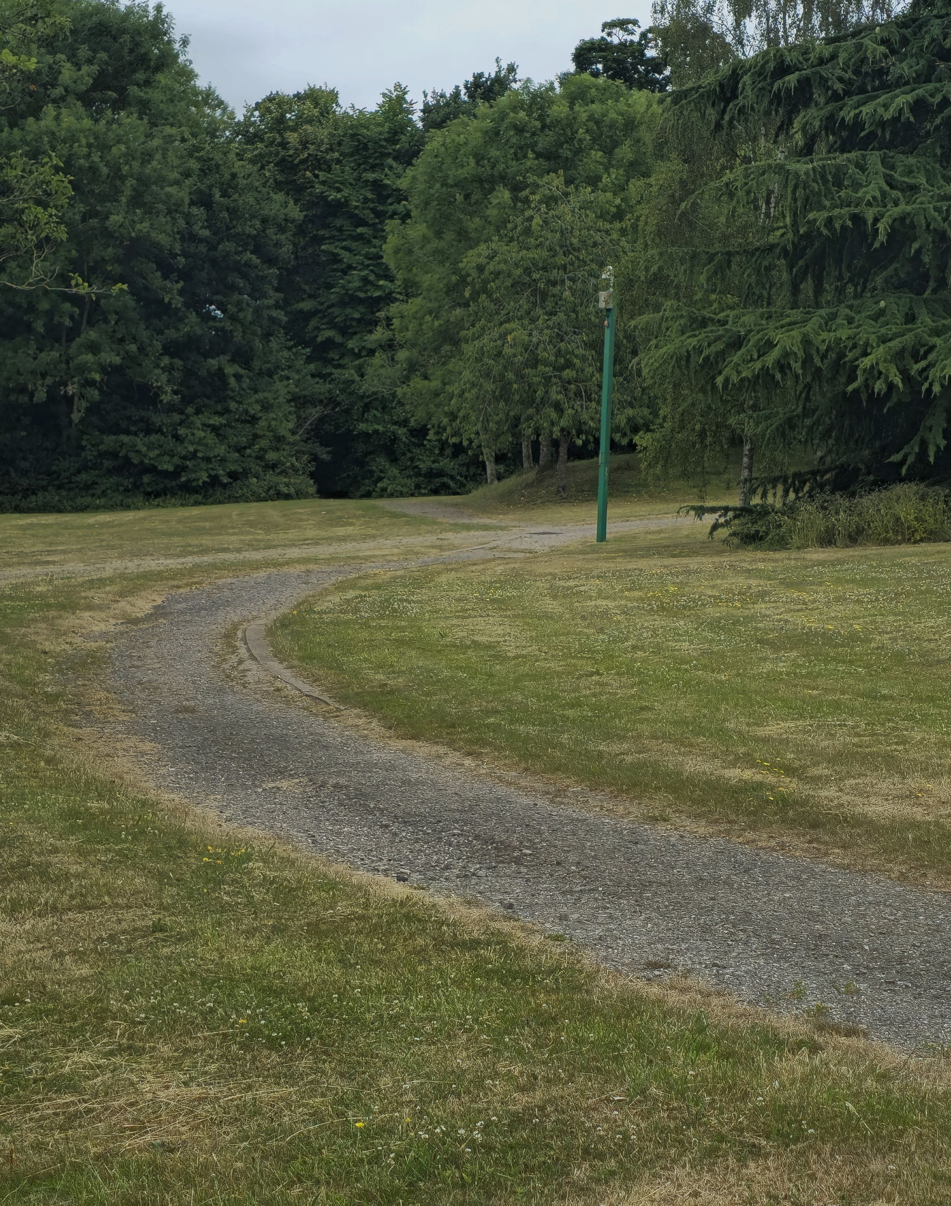 A photo taken by Baldi, A.K.A Amonn AL-Mahrouq of a path headed round a corner outside Spectrum Leisure Centre, Guildford, Surrey, United Kingdom in January 2026 asking, what are your goals this coming week?.