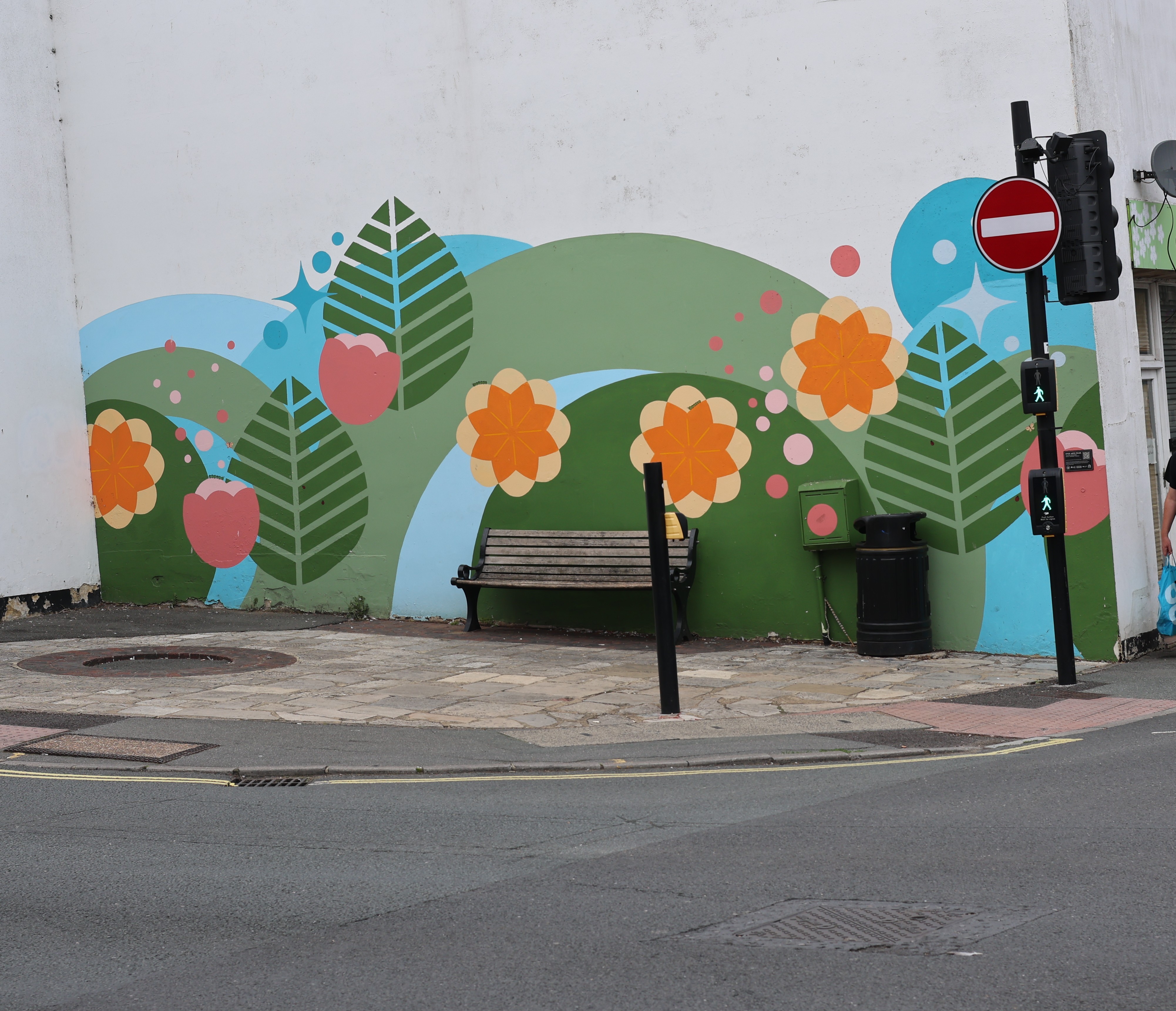 Photo of Street Art found in Ryde, Isle of Wight depicting brightly coloured flowers on a wall. Photo taken in September 2026 by Baldi, A.K.A Amonn AL-Mahrouq.